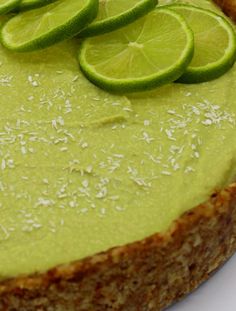 a close up of a pie with limes on top