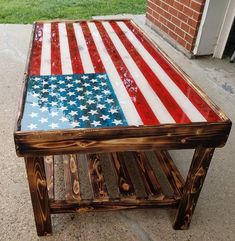 a wooden table with an american flag painted on it