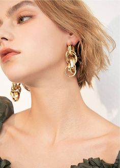 Embrace your daring side with our Goldtone Multi Hoop Drop Statement Earrings! These chic earrings feature multiple hoops that make a bold statement. Elevate any outfit and show off your unique style with these must-have statement earrings. Perfect for the risk-taker in you. 2 3/8" (6cm) drop 7/8" (2.2cm) width Post back Alloy 24k-gold plate Women's drop earrings Item #452902 Chic Metal Hoop Earrings For Party, Chic Metal Wrap Earrings For Pierced Ears, Trendy Metal Wrap Earrings, Chic Metal Wrap Earrings For Party, Chic Party Wrap Earrings In Metal, Chic Single Metal Hoop Earring, Chic Wrap Drop Earrings, Chic Metal Hoop Wrap Earrings, Metal Dangle Wrap Earrings