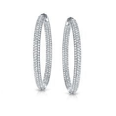 These beautiful diamond hoop earrings feature 2.00 ct. tw. round-cut natural diamonds in micro pave setting.The hoop earrings are available in your choice of 14k white or yellow gold and fasten securely with safety locks. Black Diamond Pendant, Black Diamond Studs, Halo Diamond Earrings, Solitaire Diamond Pendant, Colored Diamond Rings, Halo Earrings, Black Diamond Ring, Pave Setting, Gemstone Studs