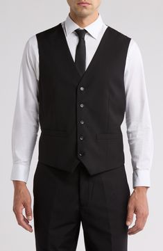 Bring understated elegance to the table in this three-piece suit crafted from rich fabric in a classic single-breasted silhouette. Jacket has notched lapels; chest welt pocket; front flap pockets Vest has front button closure; V-neck Pants have zip fly with button closure; front slant pockets; back button-welt pockets Jacket and vest are lined; trousers are lined to the knee 65% polyester, 35% viscose Dry clean Imported Each suit has a 6” drop, meaning that a size 38R jacket is paired with size Semi-formal Slim Fit Single Breasted Three-piece Suit, Semi-formal Slim Fit Three-piece Suit With Single Button, Semi-formal Slim Fit Three-piece Suit With Welt Pockets, Tailored Semi-formal Vest With Button Closure, Tailored Vest With Button Closure For Semi-formal Occasion, Elegant Vest With Notch Lapel And Button Closure, Fitted Suit Collar Vest For Work, Semi-formal Slim Fit Three-piece Suit With Lapel Collar, Semi-formal Slim Fit Three-piece Suit