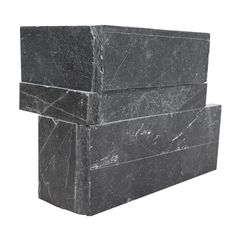 three black marble boxes stacked on top of each other