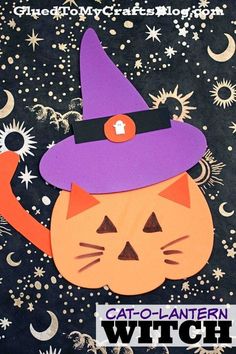 a paper cut out of a cat wearing a witches hat