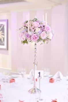 the centerpiece is decorated with pink and white flowers