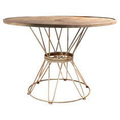 a round wooden table with metal legs and an iron wire frame around the top, against a white background