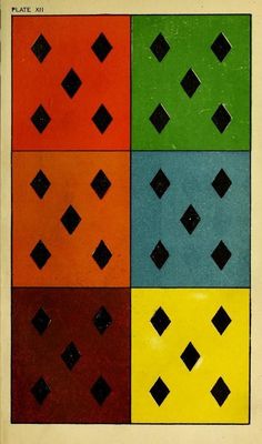 an old book with four different colored squares in each row and one black square on the bottom