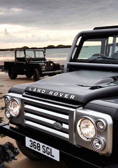 two land rover vehicles parked on the beach