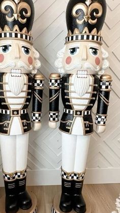 two black and white nutcrackers standing next to each other