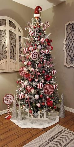 a christmas tree decorated with candy canes and candies