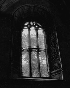 an old window is shown in black and white