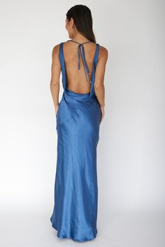 Satin maxi dress Cowl neck Backless with tie Invisible side zipper No lining You'll look like you just stepped straight off the red carpet in our gorgeous Cassiopeia dress. Featuring a cowl neckline and an open, draped back. It's perfect for a wedding or special birthday celebration. Team it with diamante heels and a clutch for a show-stopping look. MODEL INFO Model is wearing size XS Height: 5'8" Bust: 31.0" Waist: 24.0" Hips: 35.0" CARE Hand Wash Cold. Do Not Iron. MATERIAL POLYESTER Backless Satin Prom Dress, Blue Wedding Guest Dress, Satin Cowl Neck Dress, Hoco Dresses Blue, Hoco Dresses Red, Cowl Back Dress, Prom Dress Trends, Backless Gown, Mini Prom Dresses