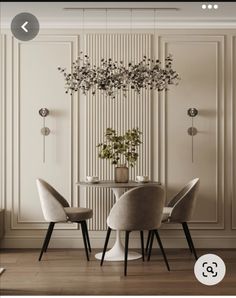 an elegant dining room with white walls and wooden floors