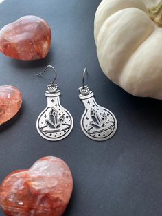 These witchy earrings share a love of crystals and bottled potions. Earrings are stainless steel. Magical Nickel-free Earrings For Gifts, Nickel-free Magical Earrings For Gift, Mystical Silver Crystal Earrings For Gifts, Nickel-free Sterling Silver Witchy Earrings, Nickel Free Sterling Silver Witchy Earrings, Witchy Earrings, Steel Bottle, Lightweight Earrings, Stainless Steel Bottle