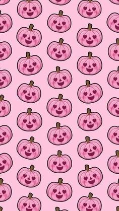 pink pumpkins with faces drawn on them, all in different shapes and sizes seamlessly