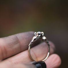 I hand carved a tiny bird skull in jewellers wax, and cast and molded it. I then used the mold to create a duplicate of the skull, and built this ring in wax. The wax model was cast using the lost wax casting method, where the wax is burned away, and the end result is solid 14k gold. The skulls are 4.5x11mm. This ring will be custom made for you, in your ring size. You can choose between yellow, rose or palladium white gold. The pictured ring is 14k yellow gold, with black rhodium that has been Carved 14k Gold Ring, Silver Brass Promise Jewelry, Silver Brass Jewelry For Promise, 14k Gold Carved Ring, White Gold Skull Jewelry For Promise Ring, Antique Sterling Silver Jewelry For Promises, Antique Sterling Silver Promise Jewelry, Hand-cast Brass Jewelry For Anniversary, Heirloom Sterling Silver Hand Cast Jewelry