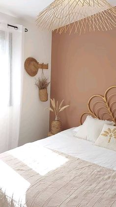 a bed with white sheets and pillows in a bedroom next to a wall mounted wicker basket