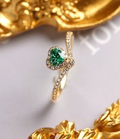 *Condition: Brand new *Center Stone: Natural Emerald from Colombia, Heart Cut approx 0.42ct (IF Color, 5A Color) *Side Stone: Natural White Diamond, round cut, approx 0.18ct (VS1 clarity and F color) *Gold Weight: 2.32g *Ring and pendent two in one Each piece is made-to-order with care and special attention to detail. all items are made with conflict-free diamonds and gems. Size: made to order The item will be gift wrapped and shipped. --------------------------------------------------------- Av Emerald Gem, Ring Heart, Buying An Engagement Ring, Ring Diamond, Natural Emerald, Emerald Ring, Conflict Free Diamonds, Solid Yellow, Wedding Ring Sets