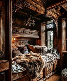 a bedroom with wood paneling and fur on the bed