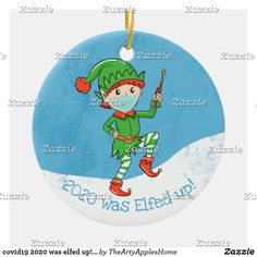 a christmas ornament with an elf holding a candy cane