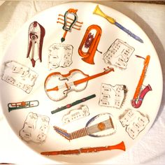 a white plate with musical instruments on it