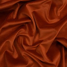 an orange fabric with very thin folds