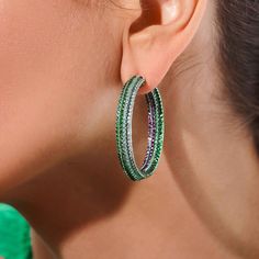 These unique inside out hoop earrings are crafted in 18 karat white gold with a green titanium coating. The earrings are set with 6.72 total carats of round brilliant cut tsavorite garnets, 2.68 total carats of round brilliant cut diamonds, 2.09 total carats of round brilliant cut rubies and 0.98 total carats of round brilliant cut pink sapphires. Reference Code: 35720 Shop other beautiful pieces in our Earring Collection.For inquiries on the piece please contact: boutique@shsilver.com Fine Jewelry Emerald Hoop Earrings In Green, Green Emerald Hoop Earrings In Fine Jewelry Style, Green Emerald Hoop Earrings Fine Jewelry, Emerald Green Hoop Earrings Fine Jewelry, Green Emerald Hoop Earrings, Luxury Green Hoop Earrings, Luxury Green Hoop Jewelry, Paris Ring, Tsavorite Garnet