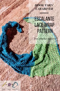 a crocheted scarf on the ground with text overlay that reads, escalaante lace wrap pattern