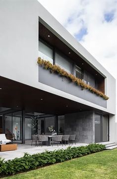 a modern house with an outdoor living area