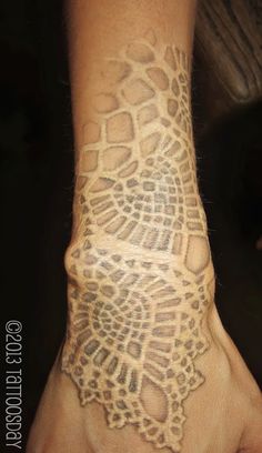 a person with a tattoo on their hand