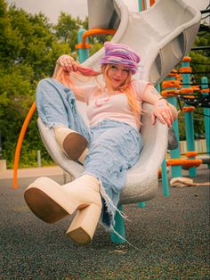 Playful Senior Pictures, Growing Up Photoshoot, Senior Picture Ideas Funky, Fun Photoshoot Props, Groovy Senior Pictures, Playground Portrait Photography, Extravagant Photoshoot Ideas, 90s Style Photography, Creative Photoshoot Locations