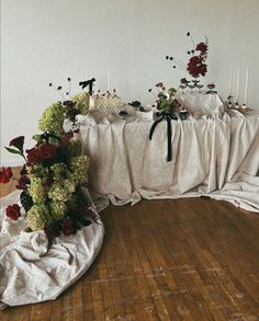 a table with flowers and candles on it