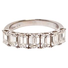 The 14k White Gold 7 VS Emerald Cut Diamonds Stackable Half Eternity Ring is a stunning testament to refined elegance and timeless beauty. Adorned with seven emerald-cut diamonds of exceptional VS clarity, totaling approximately 2 carats, this ring exudes a dazzling brilliance that captivates the eye. The sleek white gold band provides a contemporary touch, making it a versatile piece that can be worn alone or stacked with other rings for a personalized look. This exquisite ring pairs beautifull Italian Engagement Ring, Chanel Little Black Dress, 1940s Engagement Ring, Synthetic Diamond, Gold Diamond Engagement Rings, Outfit Chic, Platinum Diamond Rings, Modern Engagement Rings, Bracelet Love