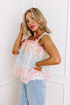 - You will look enchanting in this flirty tank! - A colorful 3D butterfly tulle material with a full lining - A straight elastic neckline and elastic back - Elastic ruffled straps - A flowy yet flattering silhouette that ends in a straight hemline White Flirty Camisole For Summer, Flirty White Camisole For Summer, Pink Ruffled Straps Tank Top, Flirty Ruffled Summer Camisole, Spring Tank Top With Spaghetti Straps And Ruffles, Flirty Spaghetti Strap Tank Top With Ruffles, Party Camisole For Spring And Summer, Spring Party Camisole, Flirty Ruffled Tank Top For Summer