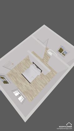 an aerial view of a living room with furniture and decor on the floor, including a bed