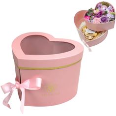 a pink heart shaped box filled with lots of flowers next to a small container full of chocolates