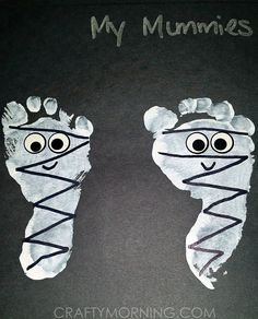 two handprints made to look like feet with googly eyes