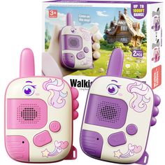 two children's electronic toys are shown in front of a box with the image of a house on it