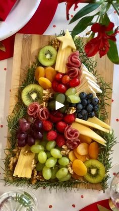 a christmas tree made out of fruits and cheese