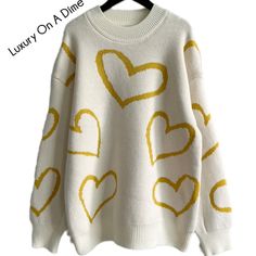 Cozy Crew Neck Top With Heart Print, Spring Sweater With Heart Print, Cute Heart Print Winter Sweater, Cute Heart Print Crew Neck Sweater, Cute Winter Sweater With Heart Print, White Heart Sweater For Winter, Trendy Heart Graphic Sweater For Fall, Cozy Crew Neck Sweater With Heart Print, Cozy Knit Sweater With Heart Design