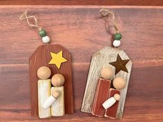 two small wooden pegs with stars on them