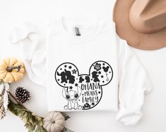 a white shirt with mickey mouse on it