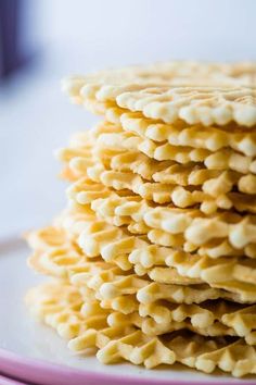 a stack of crackers sitting on top of a white plate