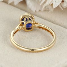 Indulge in luxury with our 14K Yellow Gold Cushion Cut Blue Sapphire Ring for Women. This captivating piece combines opulence and sophistication, featuring a mesmerizing blue sapphire gemstone elegantly set in lustrous yellow gold. Elegant Gold Tanzanite Rings, Elegant Gold Rings With Tanzanite, Luxury Royal Blue Sapphire Round Ring, Luxury Royal Blue Sapphire Ring, Royal Blue Sapphire Ring For Formal Occasions, Elegant Lab-created Sapphire Ring, Elegant Royal Blue Sapphire Ring With Center Stone, Fine Jewelry Yellow Gold Sapphire Ring With Halo Setting, Timeless Sapphire Ring With Bezel Setting