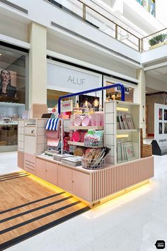 the inside of a book store with books and magazines in it's display area