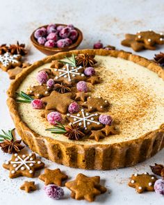 there is a pie with cookies and other decorations on it