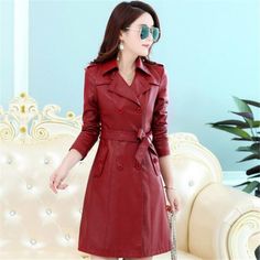 Leather Trench Coat Slim Fit Plus Size Material: PUColor: black, red, green, wine redSize: M, L, XL, XXL, XXXL, XXXXL Size Shoulder Bust Waist Front length Posterior length Sleeve M 38 88 76 92 88 58 L 39 92 80 96 89 59 XL 40 96 84 94 90 60 2XL 41 100 88 95 91 61 3XL 42 104 92 96 92 62 4XL 43 108 96 97 93 63 Fitted Leather Pea Coat For Fall, Casual Leather Double-breasted Outerwear, Leather Long Pea Coat For Fall, Fall Double-breasted Leather Jacket, Double-breasted Leather Jacket For Fall, Spring Business Long Leather Coat, Elegant Leather Jacket For Winter, Double-breasted Leather Outerwear, Double-breasted Leather Outerwear For Office