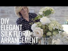 a woman arranging flowers in a vase with the words diy elegant silk floral arrangement