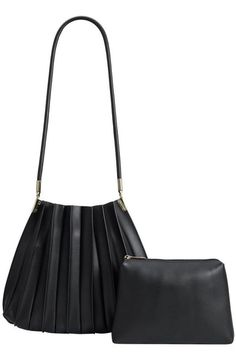 The bag of your dreams is here! Crafted from premium vegan leather, Carrie harmonizes an urban pleated design with classic shape, and gold hardware. This blend comes together to create a city-style essential. With Carrie's understated and refined glamour, she's your perfect companion for your every day and night adventures, complete with an inner matching pouch. Premium vegan leather with polyester lining Removable inner pouch One inner zip pocket Gold-tone hardware Imported Dimensions 10.5 "H, Party Bottoms, Melie Bianco, Round Handle, Shoes Sandals Heels, Backpack Travel Bag, Straw Bags, Black Shoulder Bag, Shoulder Handbag, Fall Shopping