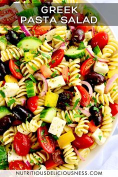 greek pasta salad in a white bowl with text overlay