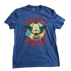 Simpsons Krusty Clown Krusty Burger Shirt Mens Size S Size Small New Without Tags No Visible Rips Stains Or Holes Crew Neck Soft Large Graphic On Front Light Blue Background 65% Polyester/35%Cotton Brought At Universal Studios Orlando Florida Measurements: Armpit To Armpit 19” Flat Length 19” Flat Measurements Are Approximate Universal Studios The Simpsons Krusty The Clown Pop Culture Cartoon Causal Unisex Krusty Burger, Krusty Shoes, Retro Blue Shirt With Funny Print, Blue Short Sleeve Shirt With Cartoon Print, Blue Retro Shirt With Funny Print, Simpsons Clothes, Orlando Florida Universal Studios, Krusty The Clown, Simpsons Shirt